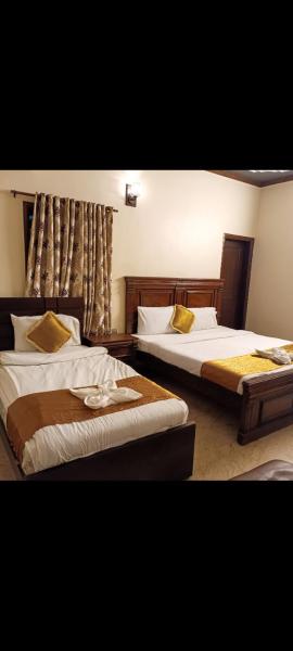 Luxury inn Rooms near Expo center , air port , agha khan
